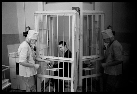 James Nachtwey, A TB patient/prisoner receives his daily oral medication at Correctional Treatment Unit #1, a TB prison colony in Tomsk, Siberia.