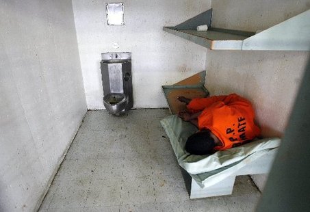 Michael Democker, An inmate sleeps in his cell in the 10th floor psychiatric section of Orleans Parish Prison, 2008