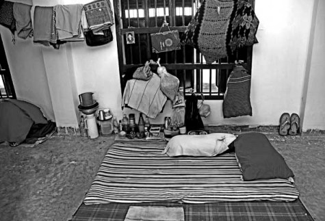 Cell, Momena Jalil, 2008. Having spent a year in prison already, 25-year-old Rahima still cannot reconcile with her living conditions. "The air, the walls, the people, the place- all of it has been a shock for me", she says. She struggles to wear the blank and emotionless expression that the rest of her inmates wear every day, yet every time she speaks of her experience in jail, she fights back tears.