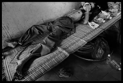 A prisoner who was convicted of murder was moved from prison to the TB ward of Battambang Provincial Hospital, Battambang, Cambodia when he was diagnosed with TB. He is coinfected with AIDS. James Nachtwey