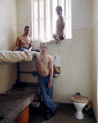 Timmy (center), with Peter (left) and Frederick, Pollsmoor Maximum Security Prison, South Africa (c-type print, 12" x 16", 2003)
