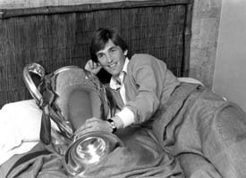 Kenny Daglish in bed with the European Cup. Copyright: Stephen Shakeshaft/ Liverpool Daily Post & Echo.