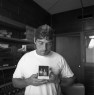 DJ David at the prison radio station holds a polaroid of he&nbsp;and