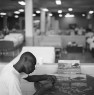 Jonathan Ennis puts a puzzle together of a farm scene in Ward 2