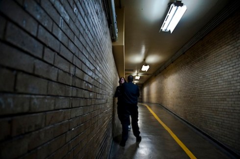 A Corrections Officer forcibly restrains an unruly prisoner who was screaming and claiming abuse by the officer. © Peter Van Agtmael, 2011