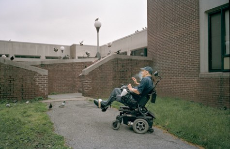 Bryan smoking a cigarette in courtyard at Goldwater Hospital, April 2012.