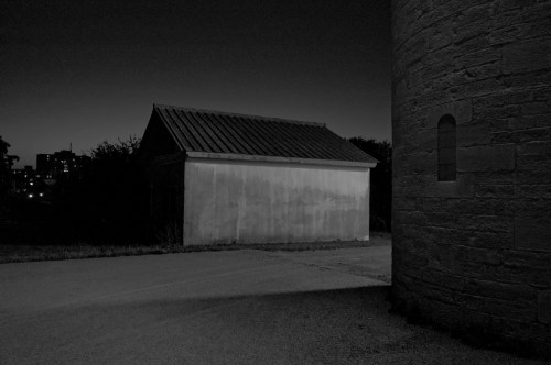 Outside the south wall with the former dog kennel.