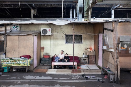 Family house. 2010 Internally displaced people from Karabakh live in cardboard homes at abandoned industrial factory in Baku since twenty years. They have never got any aid from government despite managed to build new life in these inhuman conditions. Azerbaijan. 2010